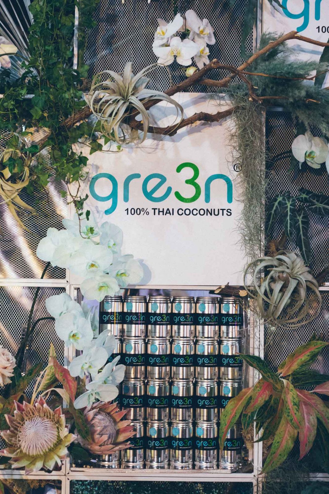 Floral wall product display with tropical plants and flowers